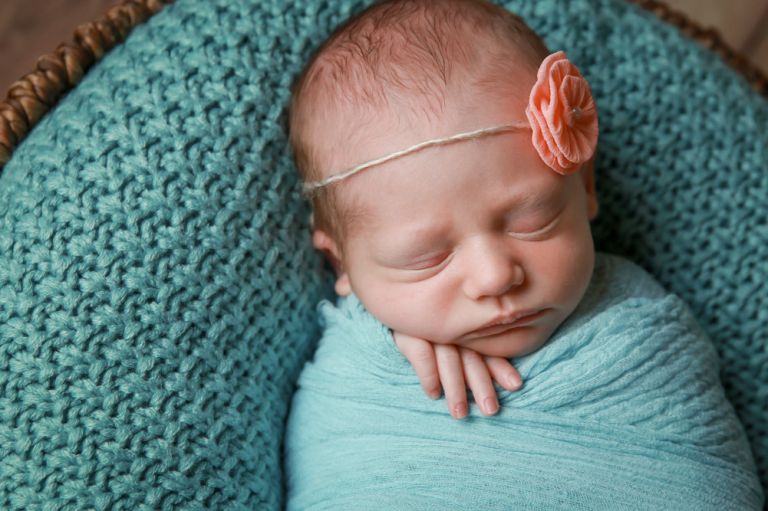 sleeping baby girl in basket