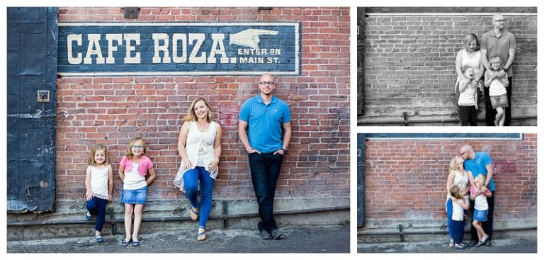 Family posing for photo on brick wall