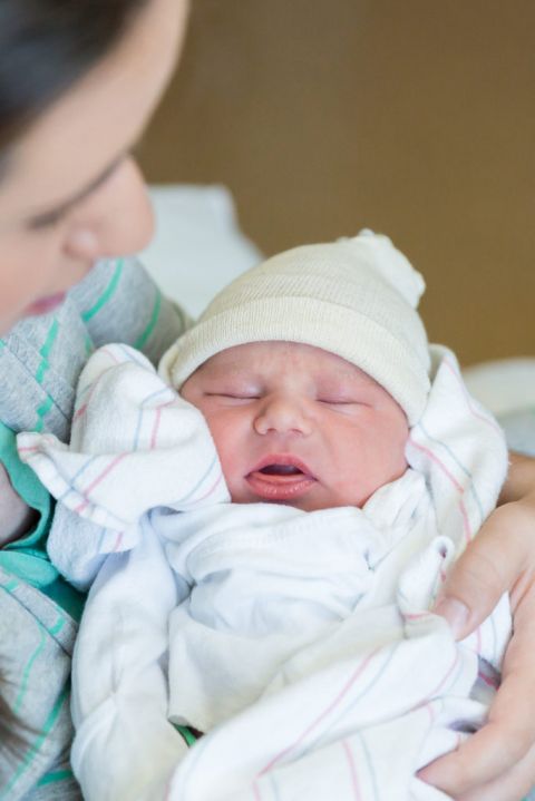 newborn baby still in hospital wrap