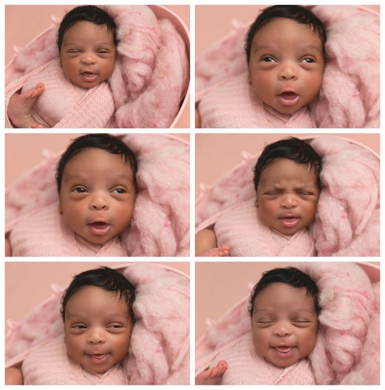 African American newborn baby girl smiling 
