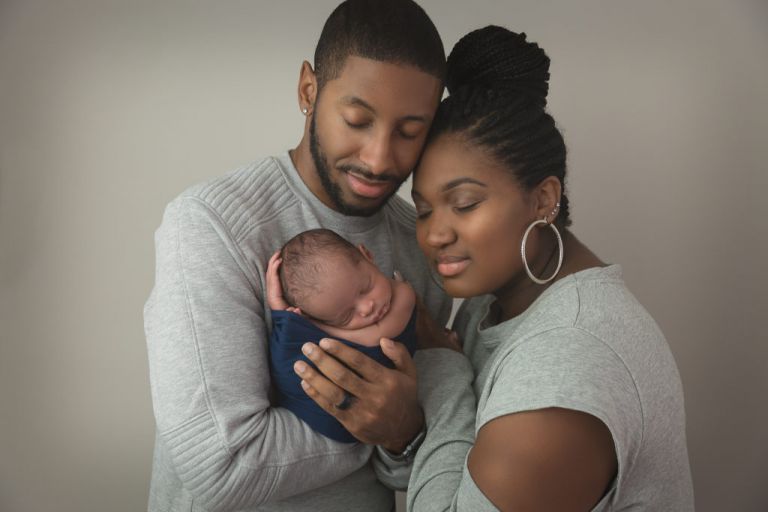 parents with newborn baby